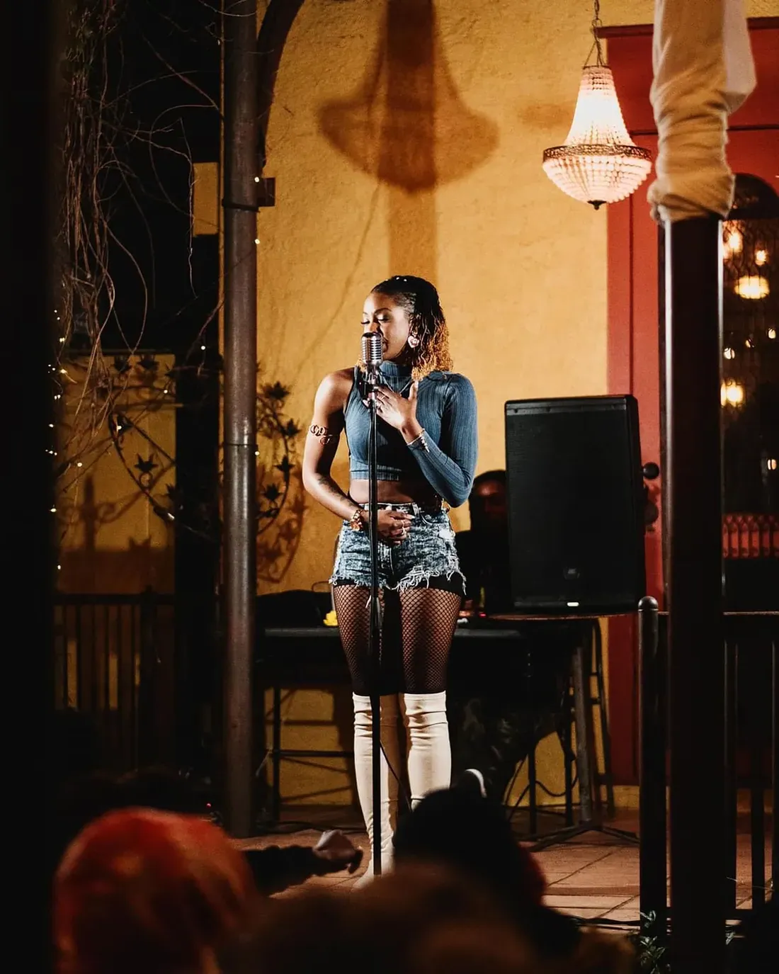 Imani Wallace on a stage performing.