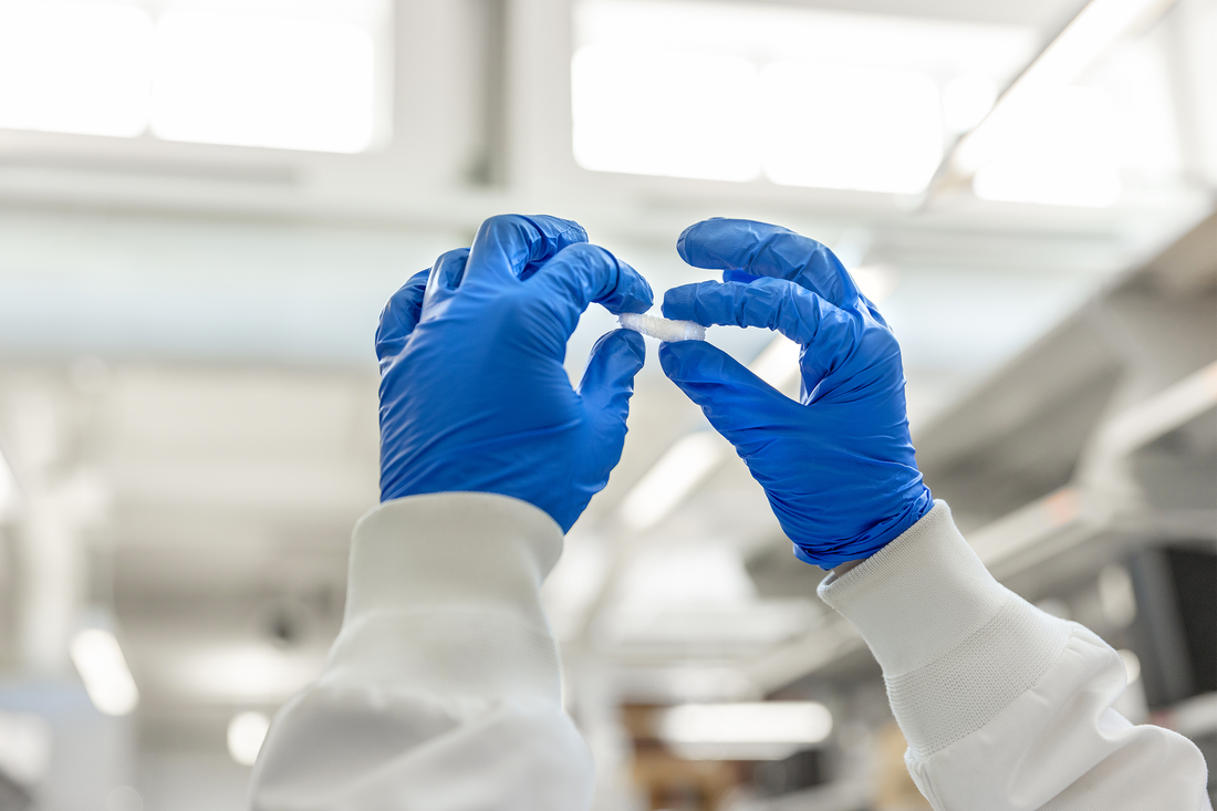 Professor Mary Beth Monroe working in lab.